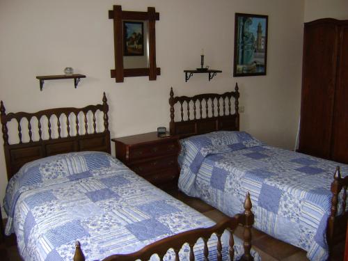 Postel nebo postele na pokoji v ubytování Stone Cottage FINISTERRE