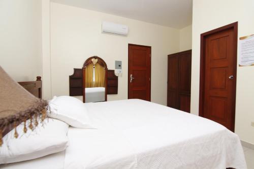 Katil atau katil-katil dalam bilik di Hotel Versailles Internacional