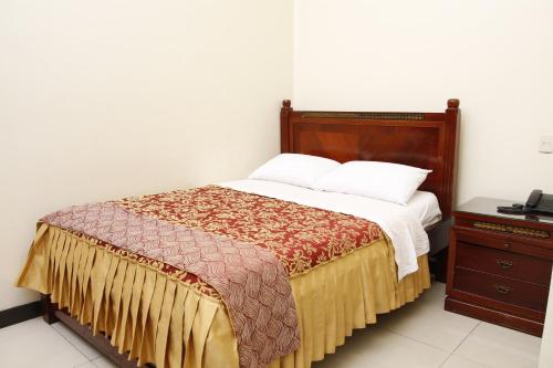 Katil atau katil-katil dalam bilik di Hotel Versailles Internacional