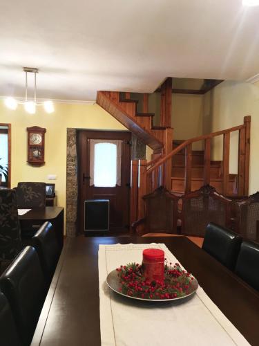 a living room with a table with a cake on it at Casa de São Sebastião in Manteigas