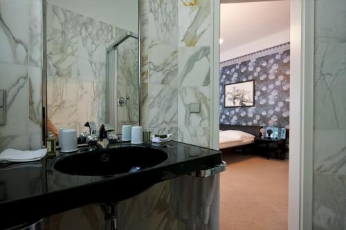 Ванна кімната в Hotel Park Villa