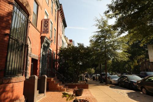 a brick building with a sign on the side of a street at Duo Housing in Washington