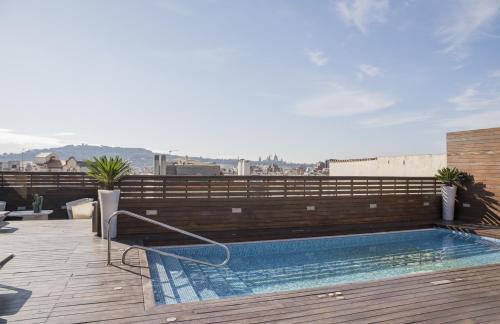 a swimming pool on the roof of a building at Hotel Lleó in Barcelona