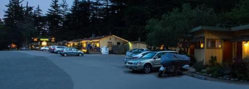 
cars parked in front of a house at Fernwood Resort in Big Sur

