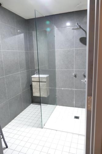 
a bathroom with a shower stall and a toilet at The Crown & Anchor Hotel in Newcastle
