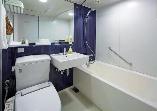 a bathroom with a white toilet and a sink at Tmark City Hotel Tokyo Omori in Tokyo