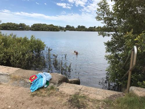 a person swimming in a body of water at Absolute Waterfront in Brisbane