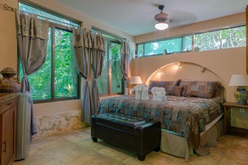 Ένα ή περισσότερα κρεβάτια σε δωμάτιο στο Hacienda Xcaret