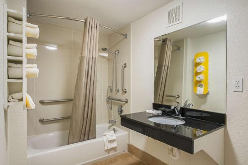 a bathroom with a sink and a tub and a shower at Motel 6-Savannah, GA - Midtown in Savannah