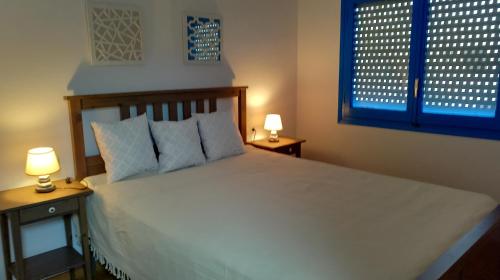 Posteľ alebo postele v izbe v ubytovaní Apartament Virginia