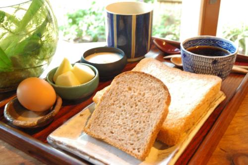 a tray with two slices of bread and eggs and coffee at Premier Inn Davis Road Lahore in Lahore