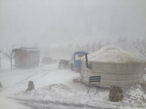 a yurt in the snow in a snow storm at Evergrin in Gadmen
