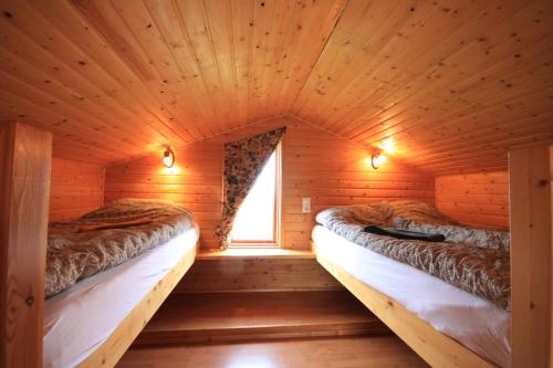 Cozy Cottage by Stay Iceland tesisinde bir odada yatak veya yataklar