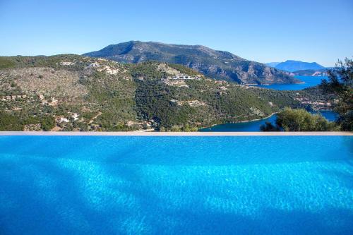 an aerial view of the water with mountains in the background at Villa Luxe in Sivota