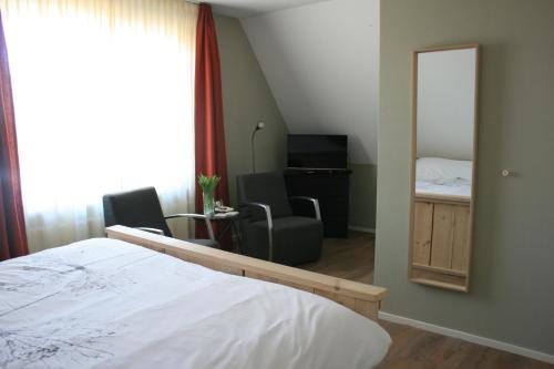 Postel nebo postele na pokoji v ubytování B&B 't Meulweegje