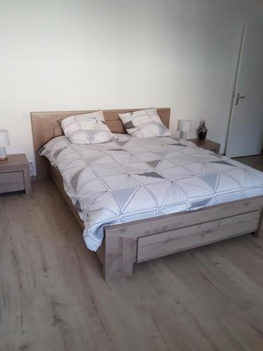 מיטה או מיטות בחדר ב-L'Ecurie des Ardennais