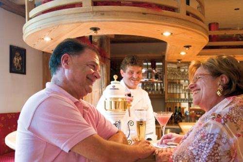 a group of people sitting at a bar at Sattelbogener Hof in Traitsching