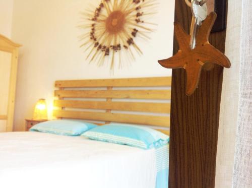 Postel nebo postele na pokoji v ubytování Agriturismo La Palascìa Masseria Agreste