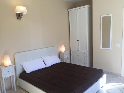 Ένα ή περισσότερα κρεβάτια σε δωμάτιο στο Giardino delle Ortensie