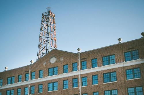 a tower on the top of a brick building at Hotel Clermont Atlanta, by Oliver in Atlanta