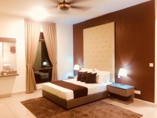 a bedroom with a bed and a ceiling fan at Evo Bangi Duplex Homestay D' Imahzzz - 3BR or 2BR in Bangi