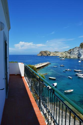 a balcony with a view of a body of water with boats at Maridea - Donatino a Mare in Ponza