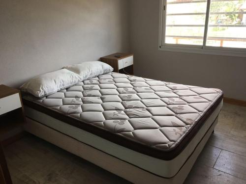 En eller flere senge i et værelse på Complejo Rafina Villa Gesell