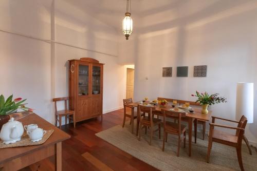 a dining room with a table and chairs at Design Apartment Eger in Eger