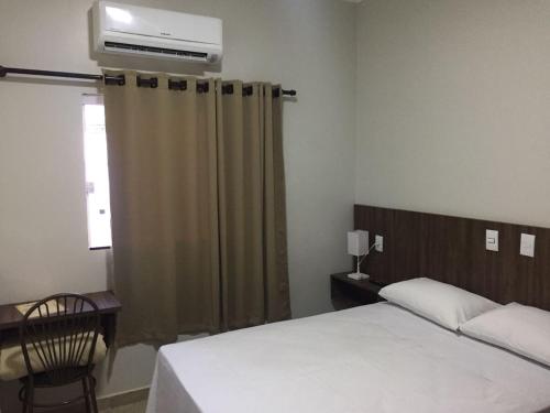 Ein Bett oder Betten in einem Zimmer der Unterkunft Hotel Redentora Plaza