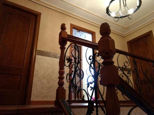 a stair railing with a clock in a window at Escapada Delux in Ossa de Montiel