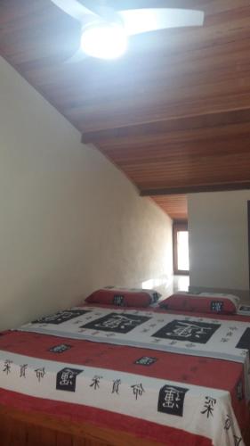 Voodi või voodid majutusasutuse Cantinho na Chi'apada toas