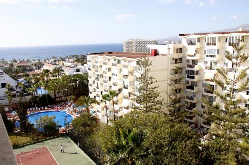 an aerial view of a building and a swimming pool at Las Americas Tenerife in Playa de las Americas
