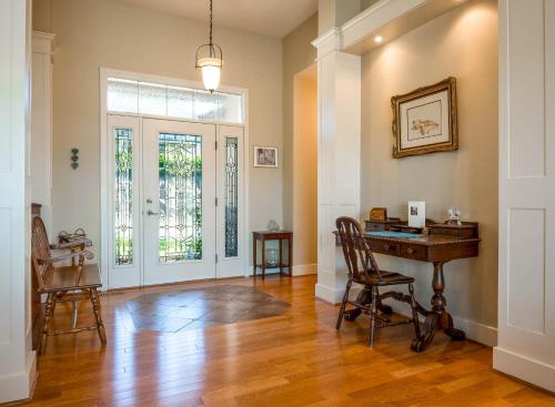 a home office with a desk and a chair at Adela's Bed and Breakfast in West Kelowna