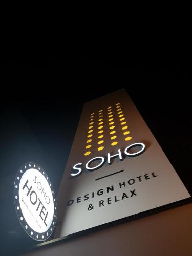a book with the logo of a design hotel and relax at Soho Hotel in Busan
