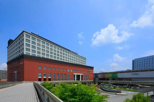a large building with a train on top of it at Hotel Nikko Nara in Nara