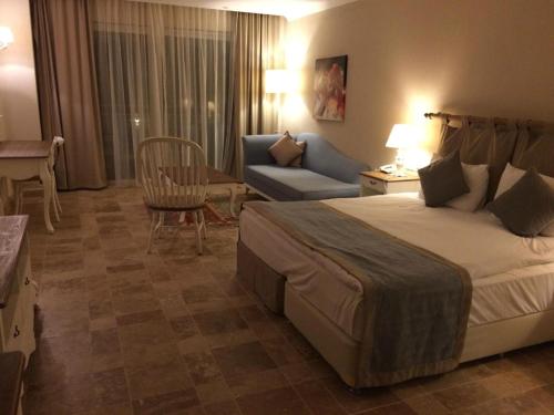 Ένα ή περισσότερα κρεβάτια σε δωμάτιο στο Andriake Beach Club Hotel - All Inclusive