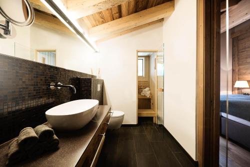 a bathroom with a sink and a toilet at Galzig Lodge in Sankt Anton am Arlberg