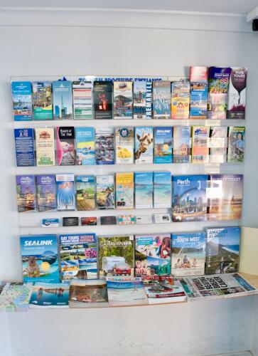 a wall filled with lots of books at Canning Bridge Auto Lodge in Perth