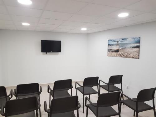 TV a/nebo společenská místnost v ubytování Hotel Mayna