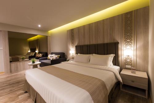 Postel nebo postele na pokoji v ubytování S.D. Avenue Hotel