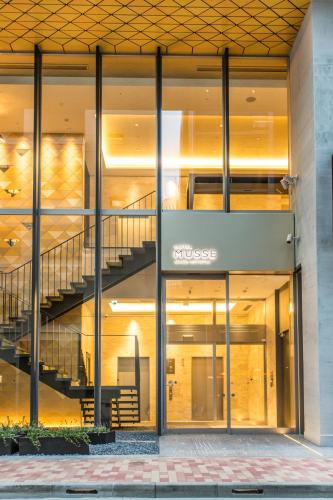 a large building with a staircase in front of it at Hotel Musse Ginza Meitetsu in Tokyo