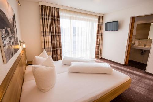 Postel nebo postele na pokoji v ubytování Appartements Platzl
