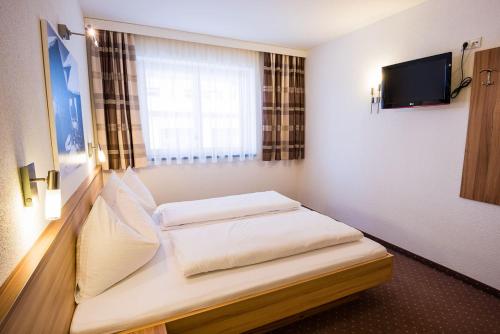 Postel nebo postele na pokoji v ubytování Appartements Platzl