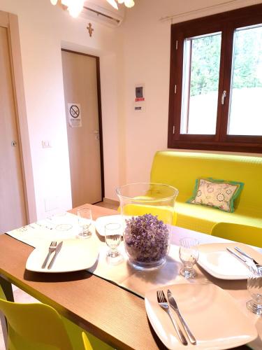 a wooden table with a bowl of food on it at villaggio casina del duca in Pescolanciano