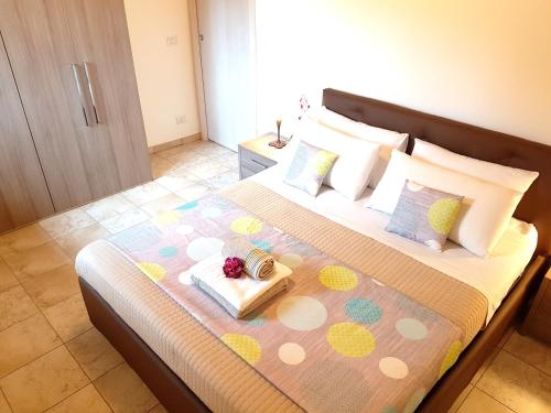 a bedroom with a bed with a tray of food on it at villaggio casina del duca in Pescolanciano