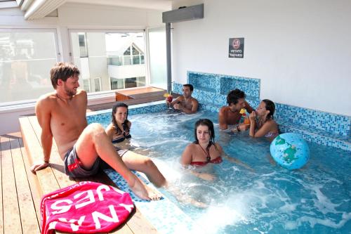 a group of people sitting in a swimming pool at Hotel Panama Majestic in Rimini