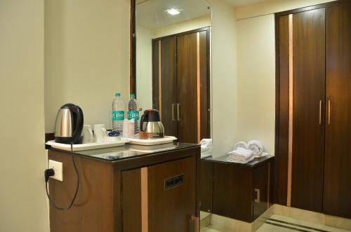 a bathroom with a sink and a mirror at Best Western Swing High Katra in Katra