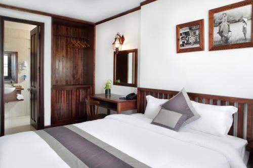 Giường trong phòng chung tại Origo Hotel Da Nang