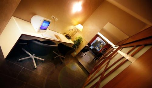 an overhead view of a office with a desk and a laptop at Hotel Monte Rosa in Chiavari