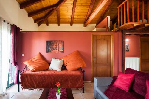 a living room with a bed and a couch at Estate Kares in Tílisos